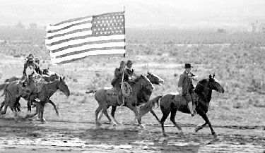 Roosevelt riding horseback at a full gallop along railroad tracks in Idaho.Photo UCR/California Museum of Photography, University of California, Riverside.