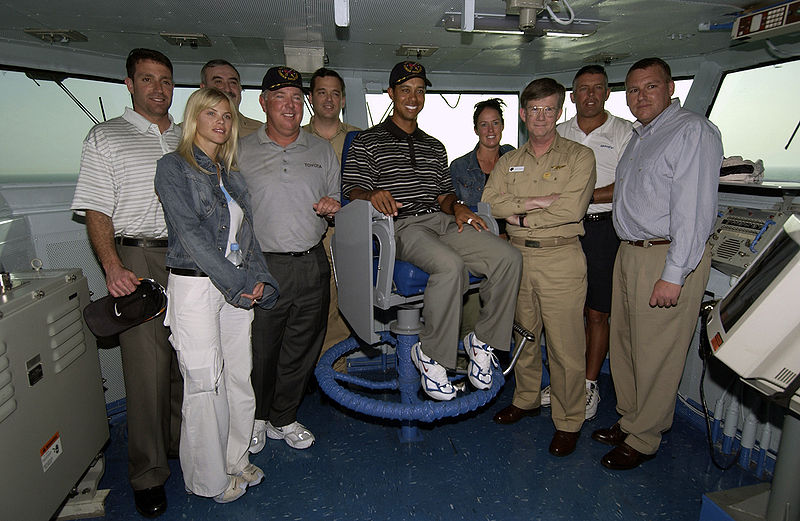File:US Navy Tiger Woods poses in admiral chair.jpg