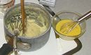 The cooked semolina and milk mixture, with the egg-cheese mixture ready to be added
