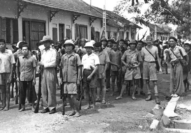 OSS Maj. Allison Thomas and Viet Minh fighters marching to Hanoi, August 1945.