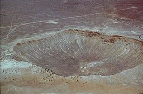 Image of a giant hole in the earth caused by a meteor.