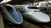 Japanese bullet trains provide high-speed services and come in a variety of designs, such as these 1990s models in Tokyo. Left: 500-series; right: 700-series.