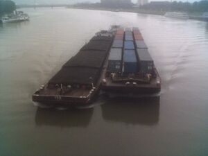 Barge carrying shipping containers.jpg