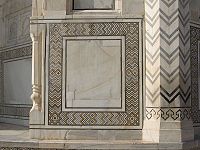 Strong geometric designs play a role throughout the complex furthering the Islamic tradition, here seen on the mausoleum's dado