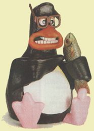 The original prototype Tux. At the recommendation of Linus Torvalds, Tux is based on this very image. The penguin figurine is of an early Aardman Studios character.