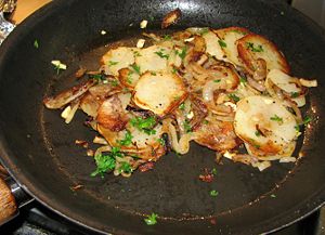 Parsley and garlic are added and cooked briefly
