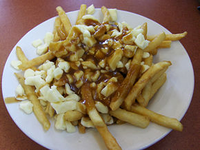 Poutine is a french fry dish of Quebec, Canada, origin. It consists of french fries topped with gravy (usually made of beef), and cheese curds.