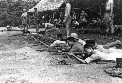 OSS Deer team members training Viet Minh fighters to use US-made weapons in 1945.