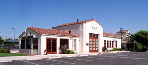 (CC) Photo: Robert A. Estremo The former combination depot of the Atchison, Topeka and Santa Fe Railway in Orange, California. The Mediterranean Revival Style structure was dedicated on May 1, 1938 and was closed with the discontinuation of passenger service in 1971. The building was granted historic landmark status by the City on November 15, 1990. As of 2011 the facilty has served as home to a Ruby's Diner.