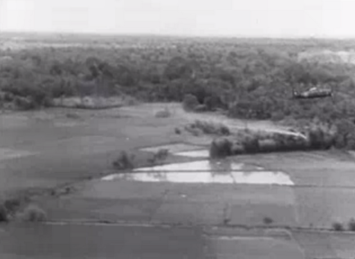 French plane pulling up after a dive to drop napalm bombs on Vietminh force ambushing a French battalion. The white streak below the plane, clearly visible against the dark background of trees further behind, was the napalm bomb that was just dropped. 1953 December.