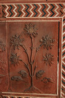 Floral carving on red sandstone at the Mosque.