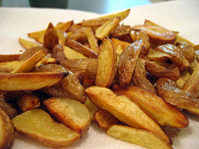 Wedge-cut fries are prepared from small, whole, unpeeled potatoes cut lengthways into quarters or sixths to form the wedges. As can be seen in this photo, the wedges need not be uniform. Wedge-cut fries are often prepared through oven-fry methods to produce a dish lower in fat.
