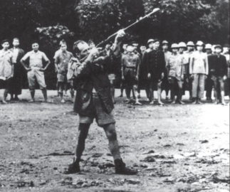 OSS Deer team training the Viet Minh to use a grenade launcher.