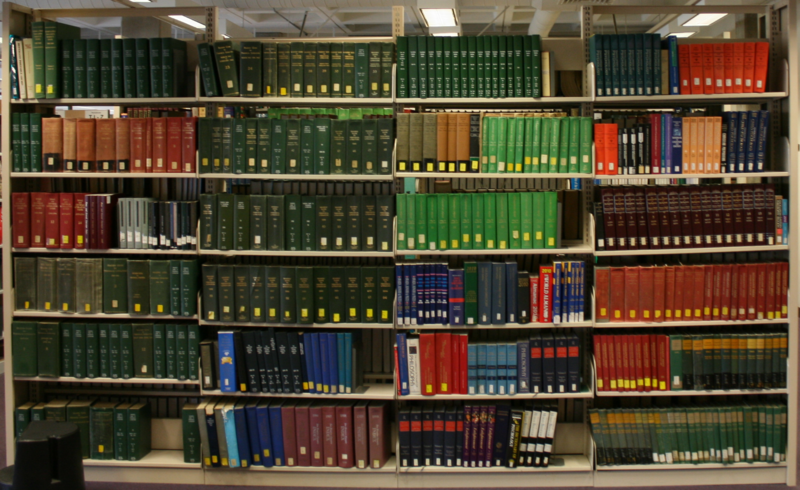 File:Library shelf with reference works.png