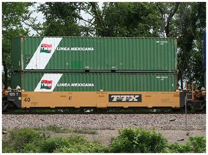 Intermodal shipping containers on a railway flat car.jpg
