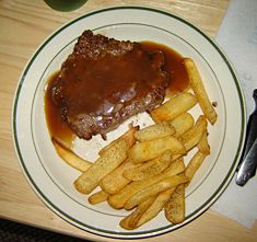 Steak fries, sometimes called ranch fries, are thick, flat-cut french fries, about 1 inch (0.6 cm) ½ inch (1.3 cm). Prepared from either peeled or unpeeled potatoes, they are often the culinary choice to convey a particularly "hearty" appearance. These steak fries have been peppered with black pepper.