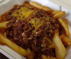 Chili fries consist of french fries topped with a generous helping of chili, a spicy bean and meat dish, sprinkled with grated cheese.
