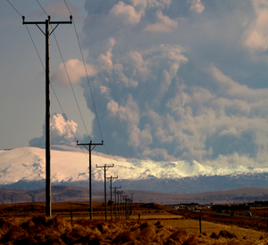 Overhead power line in front of volcano.png