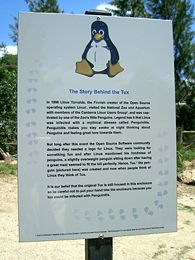 Sign at the National Zoo & Aquarium, Canberra, Australia, by their penguin exhibit. The sign describes the story of Trovalds catching "penguinitis" and the origins of Tux.