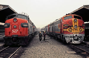 (CC) Photo: Drew Jacksich Santa Fe #340, leading the San Diegan, and Southern Pacific #6451, heading up The Sunset, both lay over at the Los Angeles Union Passenger Terminal in March, 1971.